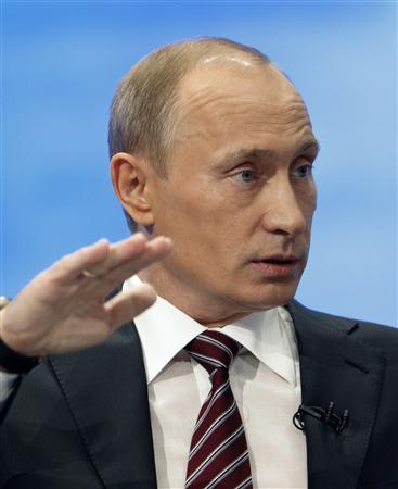 Russia's Prime Minister Vladimir Putin answers questions during ...