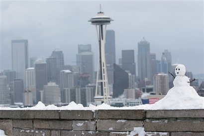 A snowman built on Kerry Park's wall is seen Thursday, Dec. ...