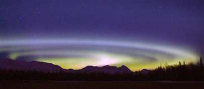 In this Feb. 29, 2008 file photo, an Aurora Borealis spins above ...